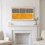 Frame TV art above a white fireplace with candles and eucalyptus on the mantel