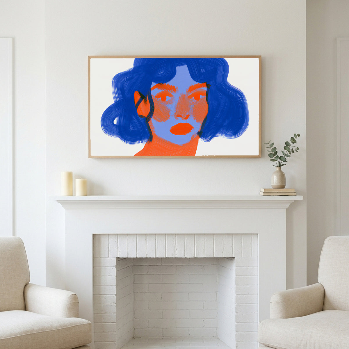 Blue hair portrait art above a white fireplace with candles and eucalyptus on the mantel