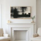 Black and white abstract art above a white fireplace with candles and eucalyptus on the mantel