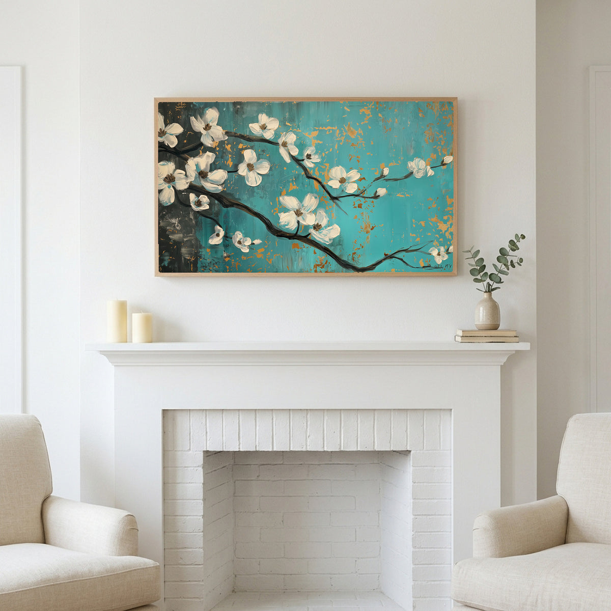 Frame TV art above a white fireplace with candles and eucalyptus on the mantel