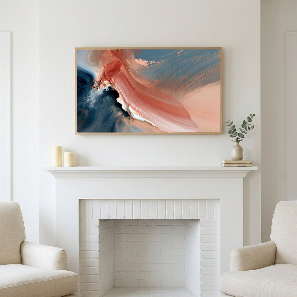 Coral and navy abstract art above a white fireplace with candles and eucalyptus on the mantel