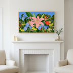 Tropical flower garden art above a white fireplace with candles and eucalyptus on the mantel