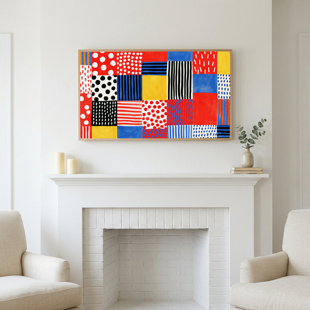 Polka dot patchwork art above a white fireplace with candles and eucalyptus on the mantel