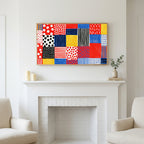 Polka dot patchwork art above a white fireplace with candles and eucalyptus on the mantel