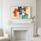 Frame TV art above a white fireplace with candles and eucalyptus on the mantel