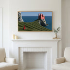 Sea cliff castle art above a white fireplace with candles and eucalyptus on the mantel