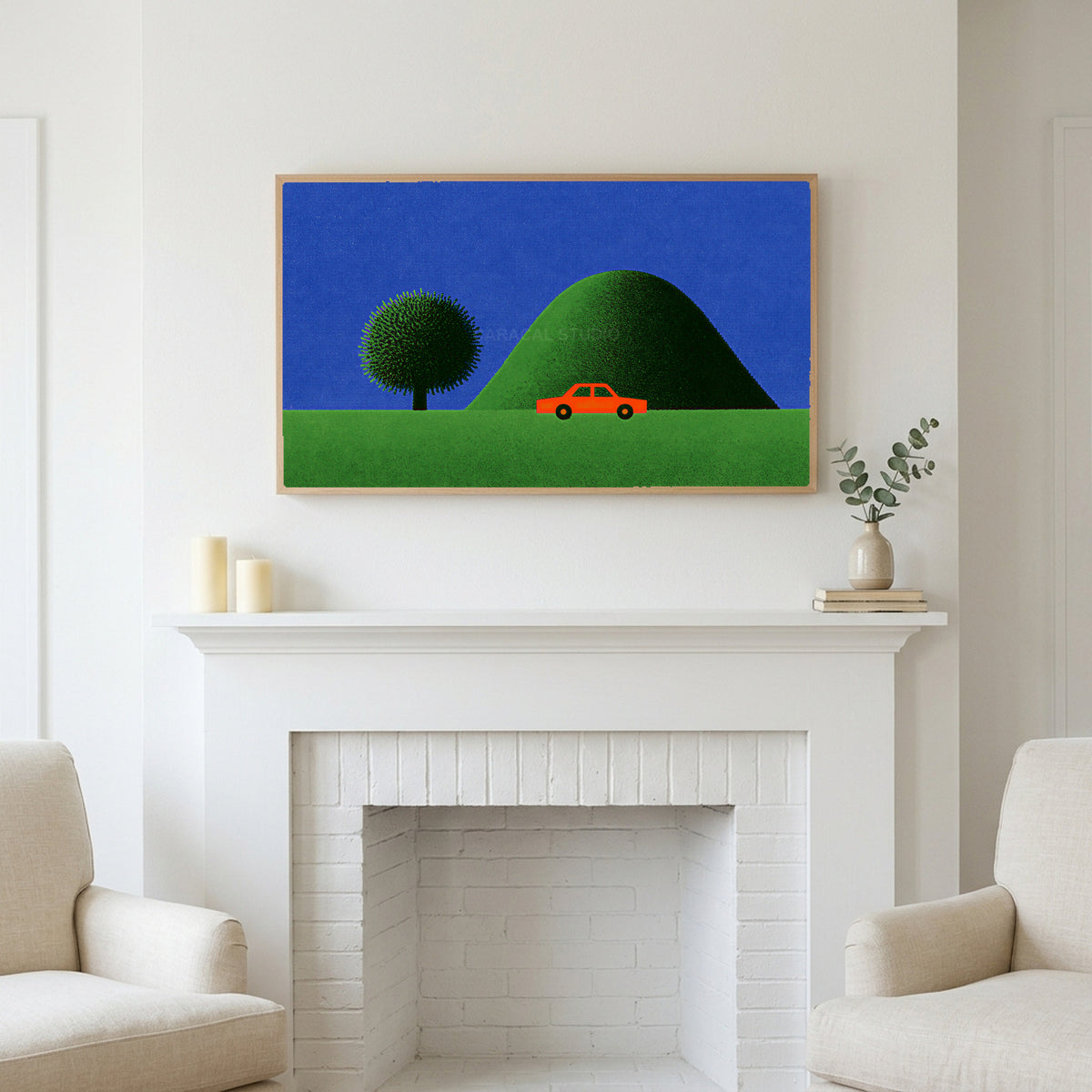 Red car by a green hill art above a white fireplace with candles and eucalyptus on the mantel