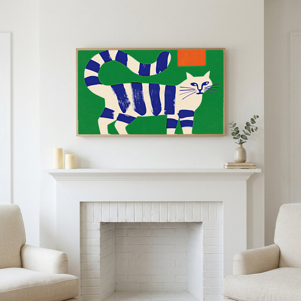 Blue striped cat art above a white fireplace with candles and eucalyptus on the mantel