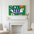Blue striped cat art above a white fireplace with candles and eucalyptus on the mantel
