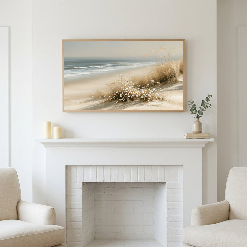 Dune grass and daisies art above a white fireplace with candles and eucalyptus on the mantel