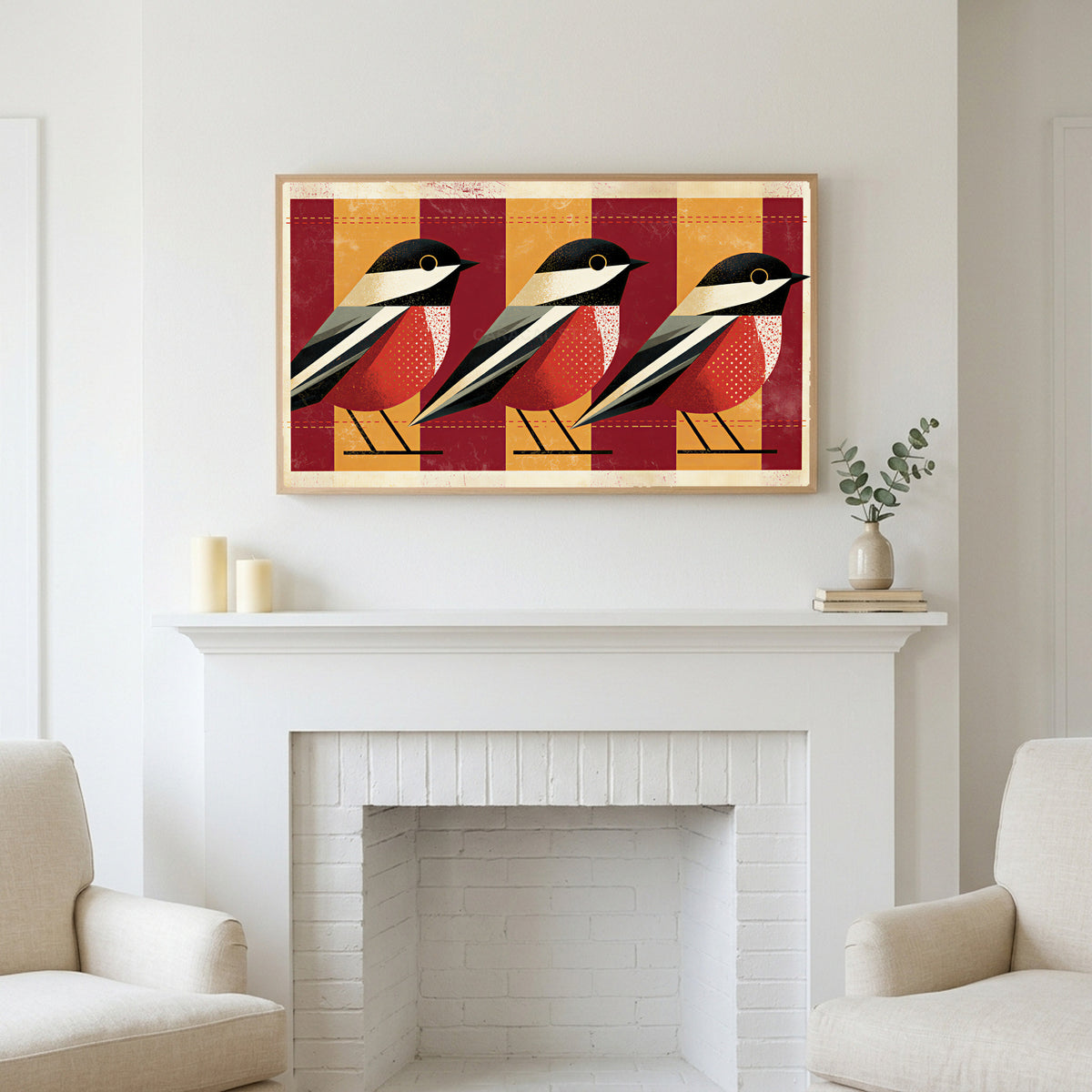 Geometric birds art above a white fireplace with candles and eucalyptus on the mantel