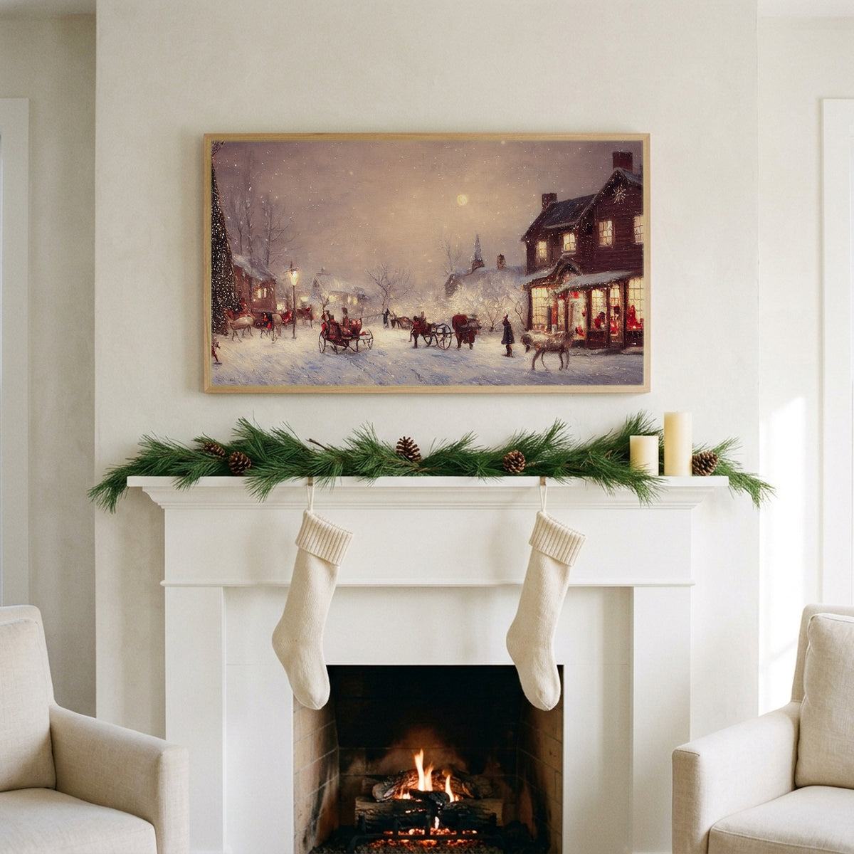 Snowy town with reindeer sleighs art on a TV above a white fireplace with a pine garland and cream stockings
