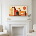 Retro horses art above a white fireplace with candles and eucalyptus on the mantel
