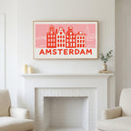 Amsterdam canal houses art above a white fireplace with candles and eucalyptus on the mantel