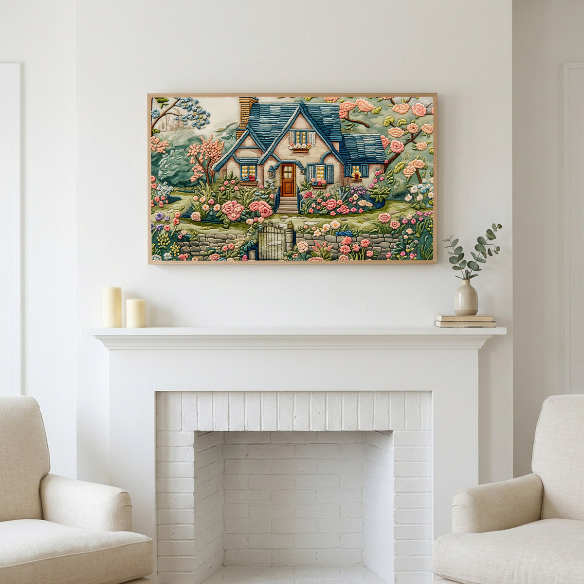 Frame TV art above a white fireplace with candles and eucalyptus on the mantel