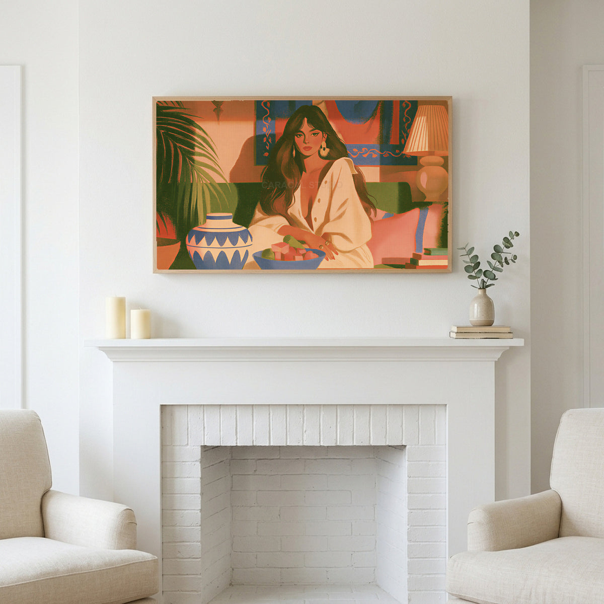 Boho woman portrait art above a white fireplace with candles and eucalyptus on the mantel