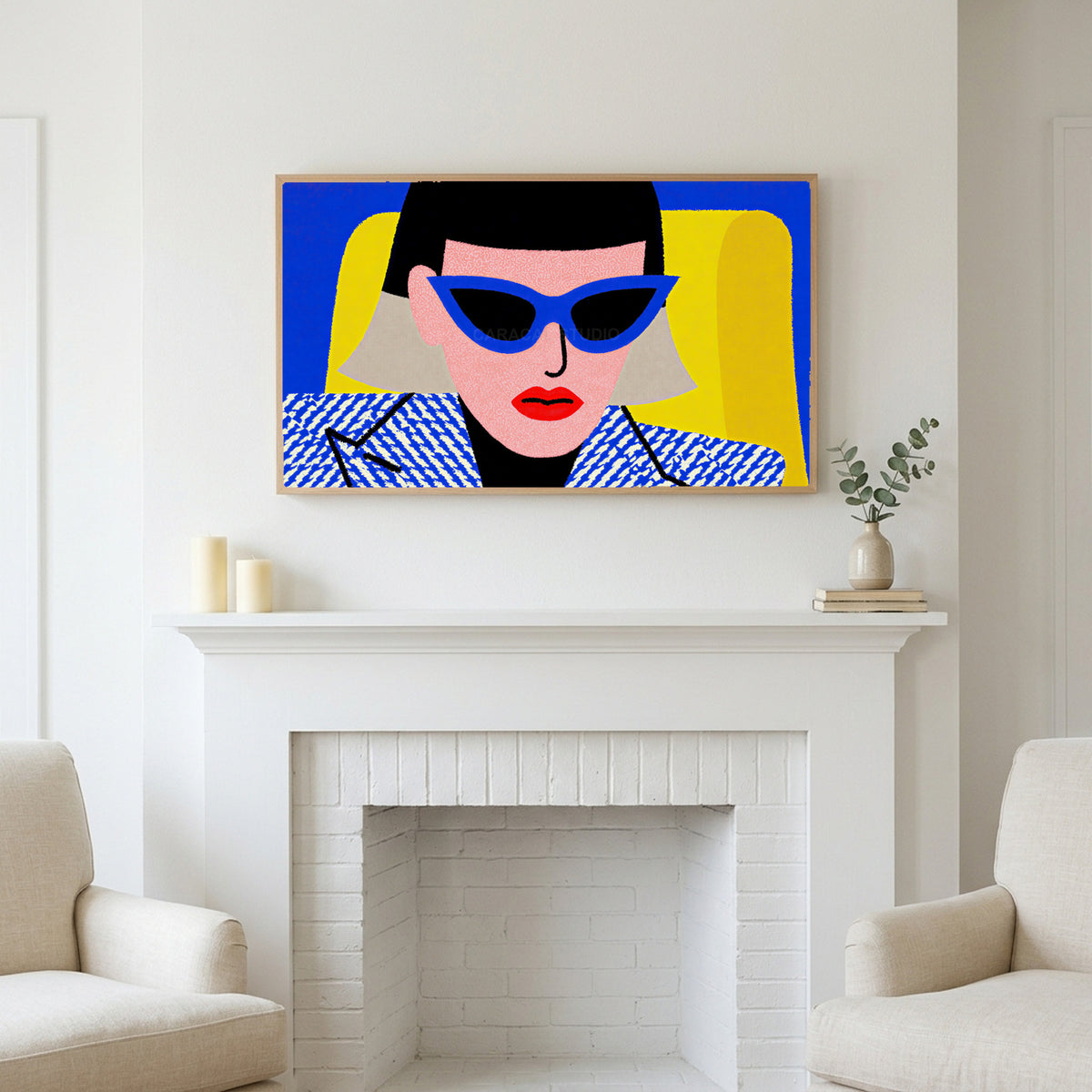 Pop art woman in sunglasses art above a white fireplace with candles and eucalyptus on the mantel