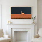 Lone cottage art above a white fireplace with candles and eucalyptus on the mantel