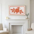Pomegranate linocut art above a white fireplace with candles and eucalyptus on the mantel