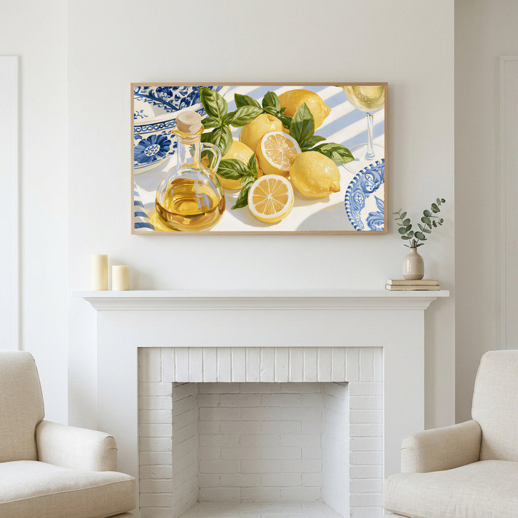 Lemons and olive oil art above a white fireplace with candles and eucalyptus on the mantel