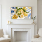 Lemons and olive oil art above a white fireplace with candles and eucalyptus on the mantel