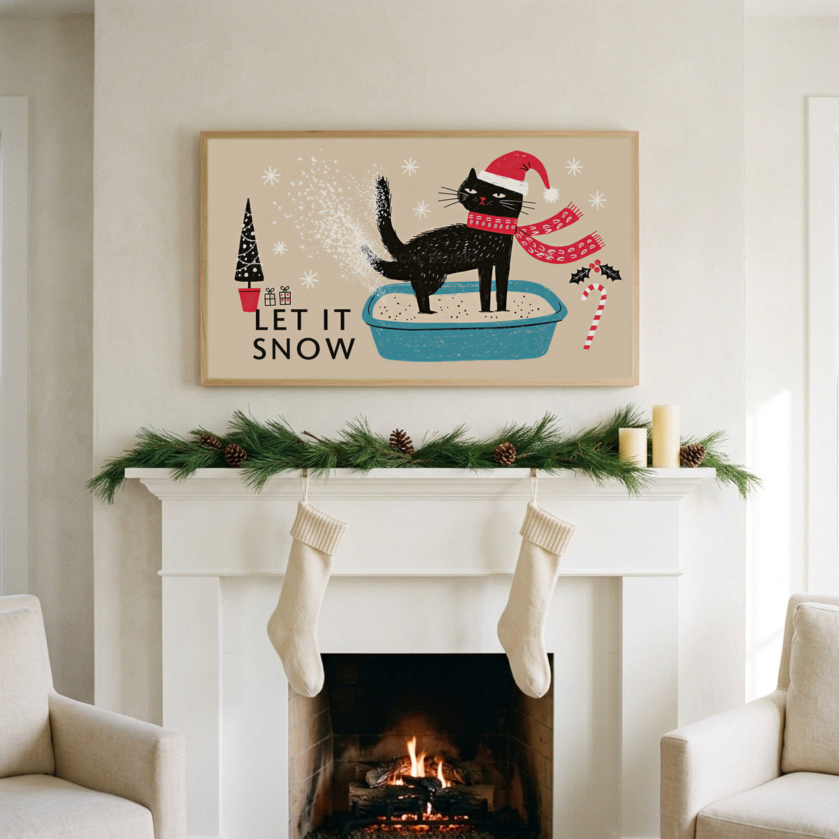 Let It Snow cat art on a TV above a white fireplace with a pine garland and cream stockings