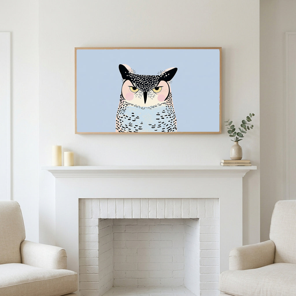 Grumpy owl art above a white fireplace with candles and eucalyptus on the mantel