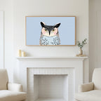 Grumpy owl art above a white fireplace with candles and eucalyptus on the mantel