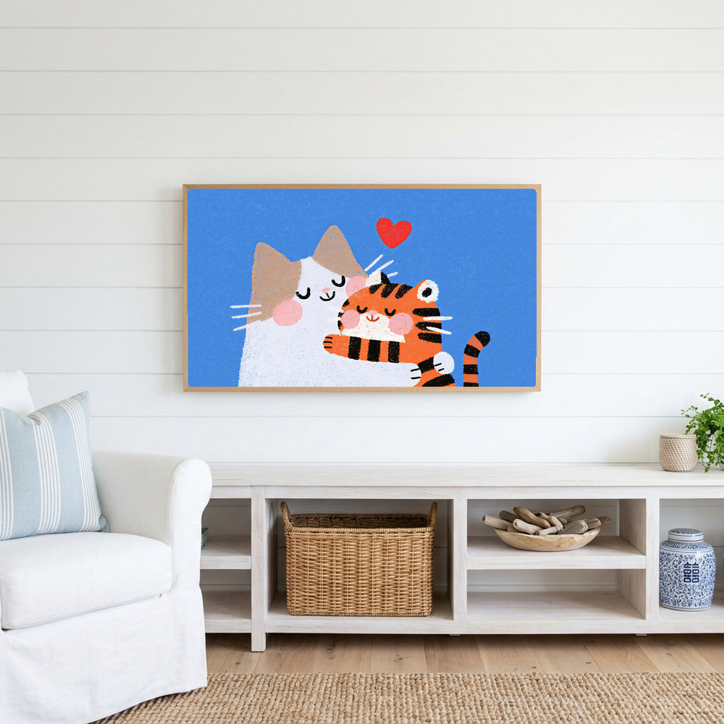 Two cats with a heart Frame TV art above a white console with a rattan basket in a coastal living room