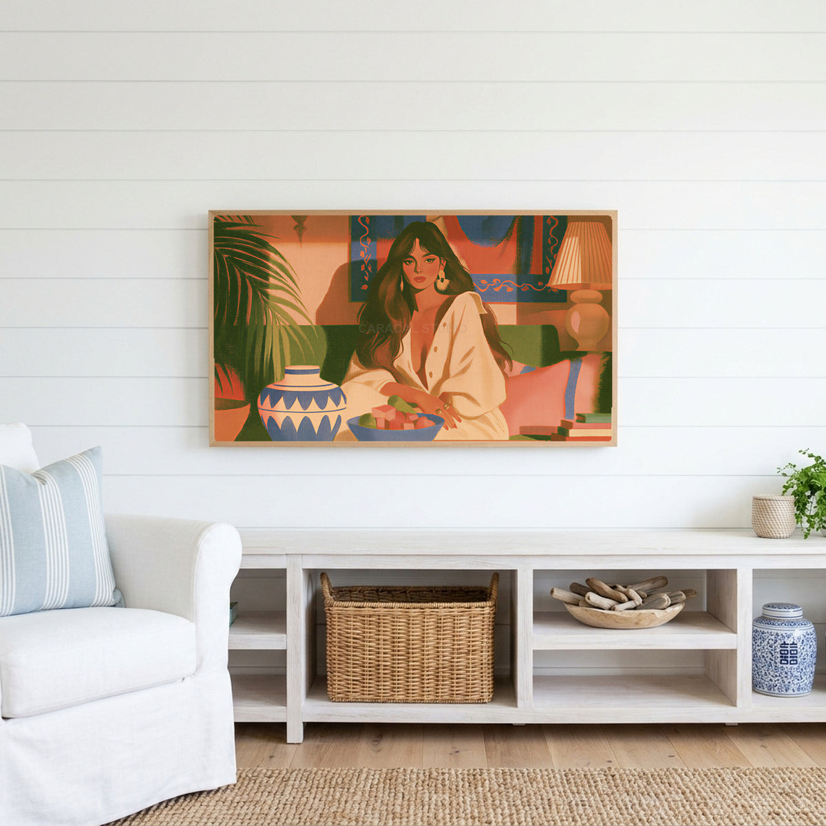 Boho woman portrait Frame TV art above a white console with a rattan basket in a coastal living room
