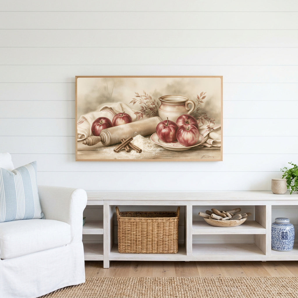Farmhouse apples Frame TV art above a white console with a rattan basket in a coastal living room