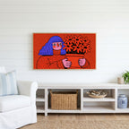 Blue hair portrait Frame TV art above a white console with a rattan basket in a coastal living room