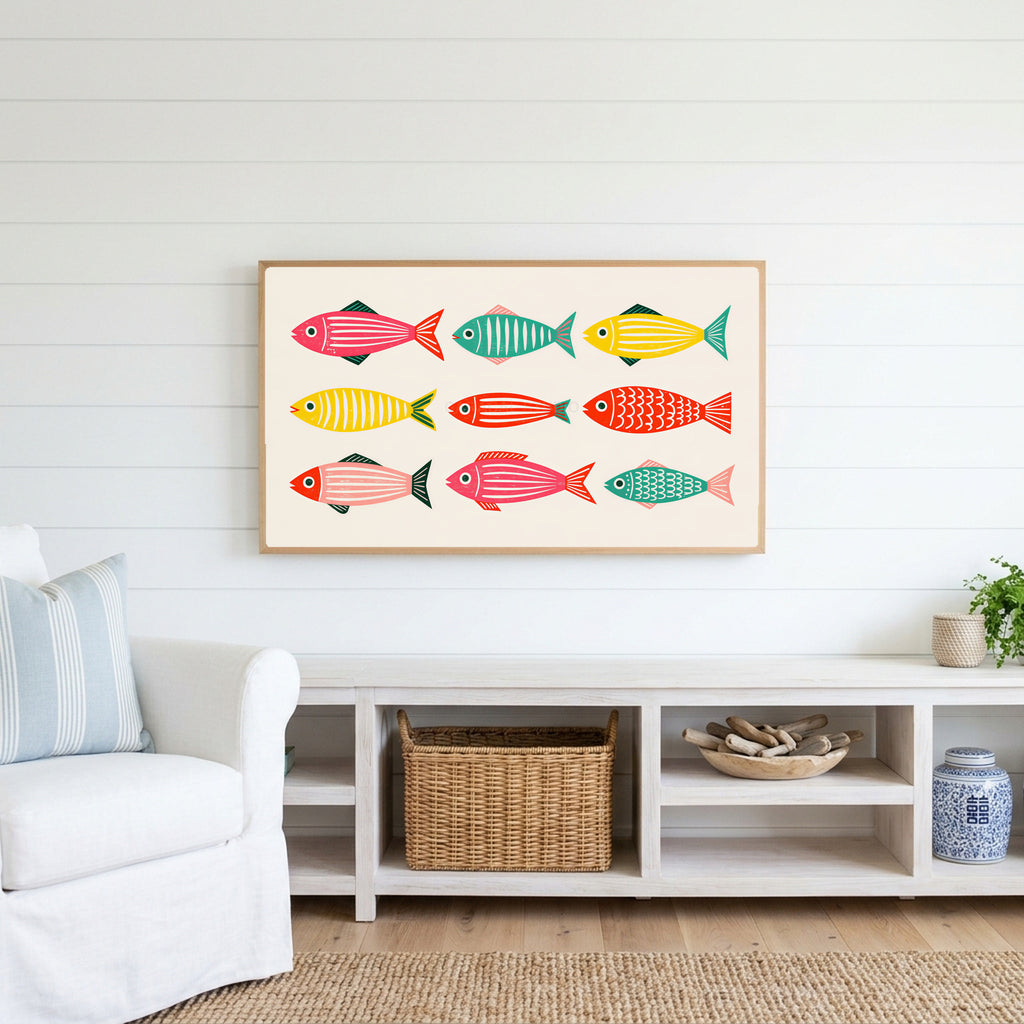 Folk fish Frame TV art above a white console with a rattan basket in a coastal living room