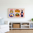 Food and wine doodles Frame TV art above a white console with a rattan basket in a coastal living room