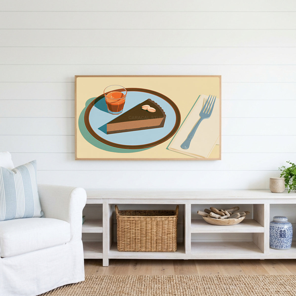 Chocolate tart and espresso Frame TV art above a white console with a rattan basket in a coastal living room