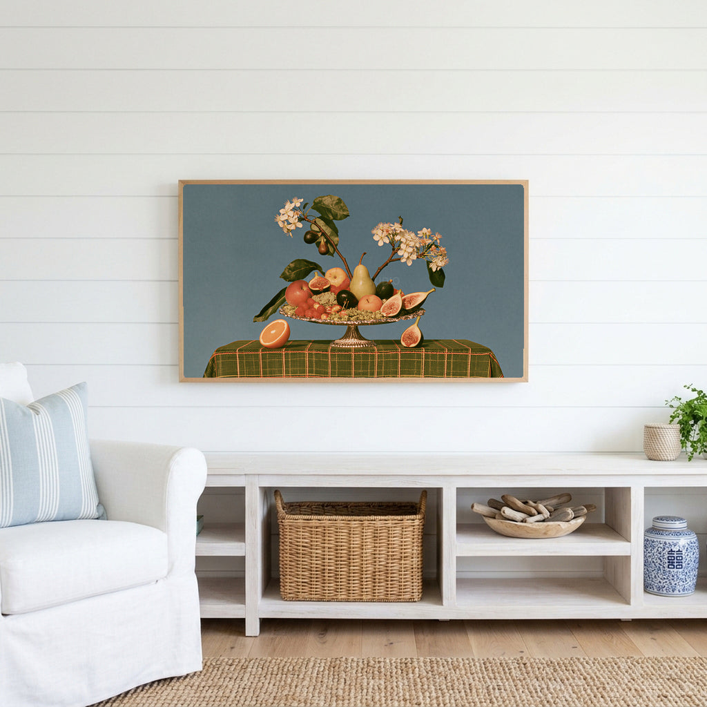 Fruit still life Frame TV art above a white console with a rattan basket in a coastal living room