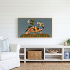 Fruit still life Frame TV art above a white console with a rattan basket in a coastal living room
