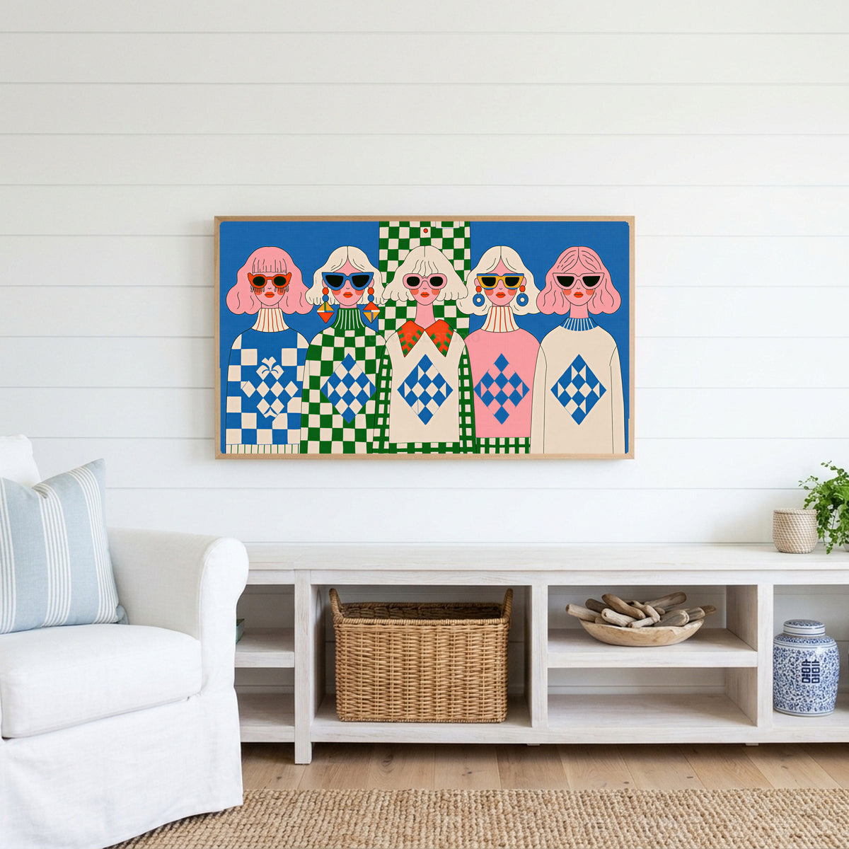 Retro women in sunglasses Frame TV art above a white console with a rattan basket in a coastal living room