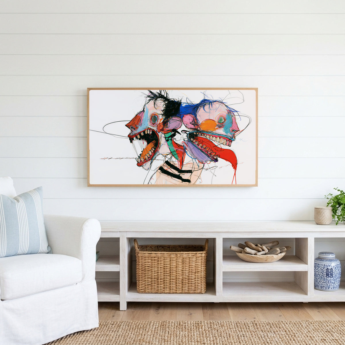 Expressive faces Frame TV art above a white console with a rattan basket in a coastal living room