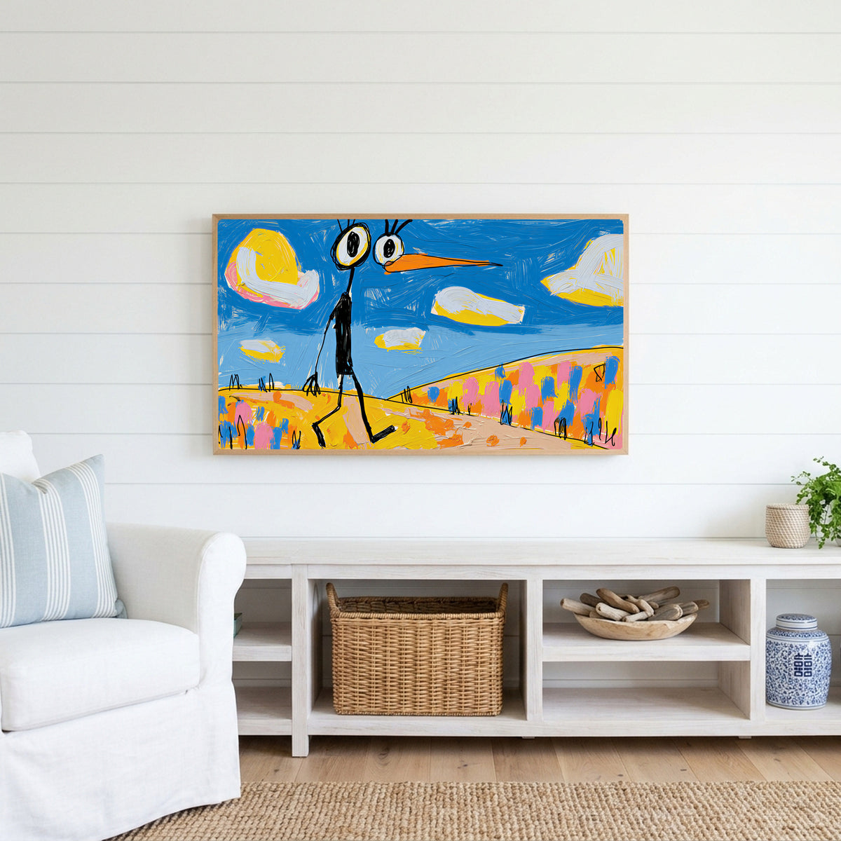 Funny alien bird Frame TV art above a white console with a rattan basket in a coastal living room