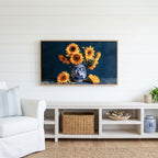 Sunflower still life Frame TV art above a white console with a rattan basket in a coastal living room