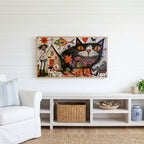 Grinning black cat Frame TV art above a white console with a rattan basket in a coastal living room