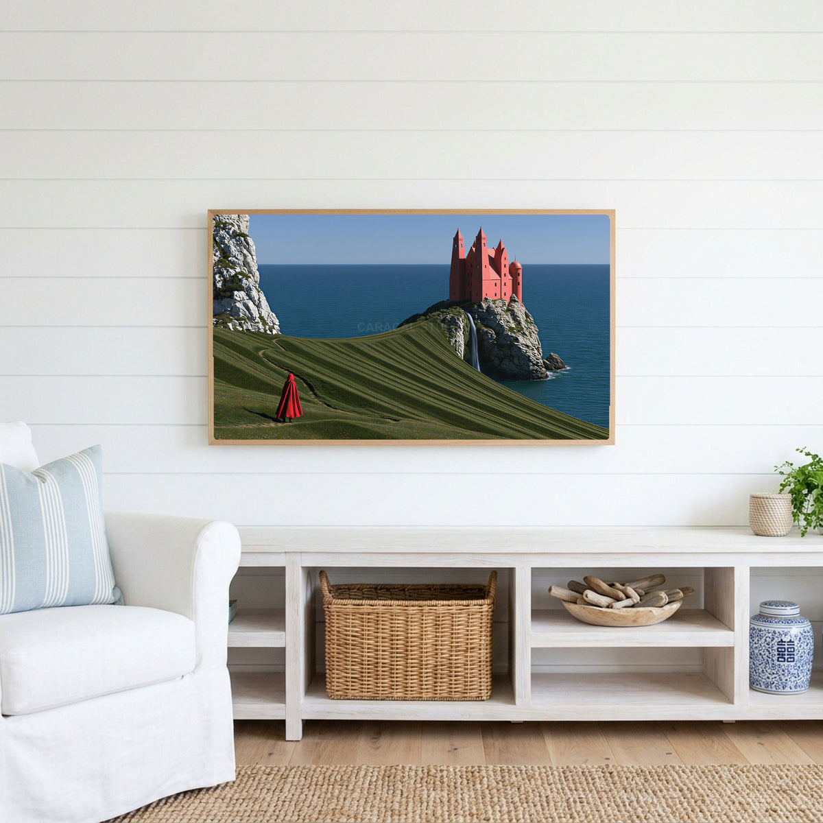 Sea cliff castle Frame TV art above a white console with a rattan basket in a coastal living room