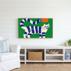 Blue striped cat Frame TV art above a white console with a rattan basket in a coastal living room