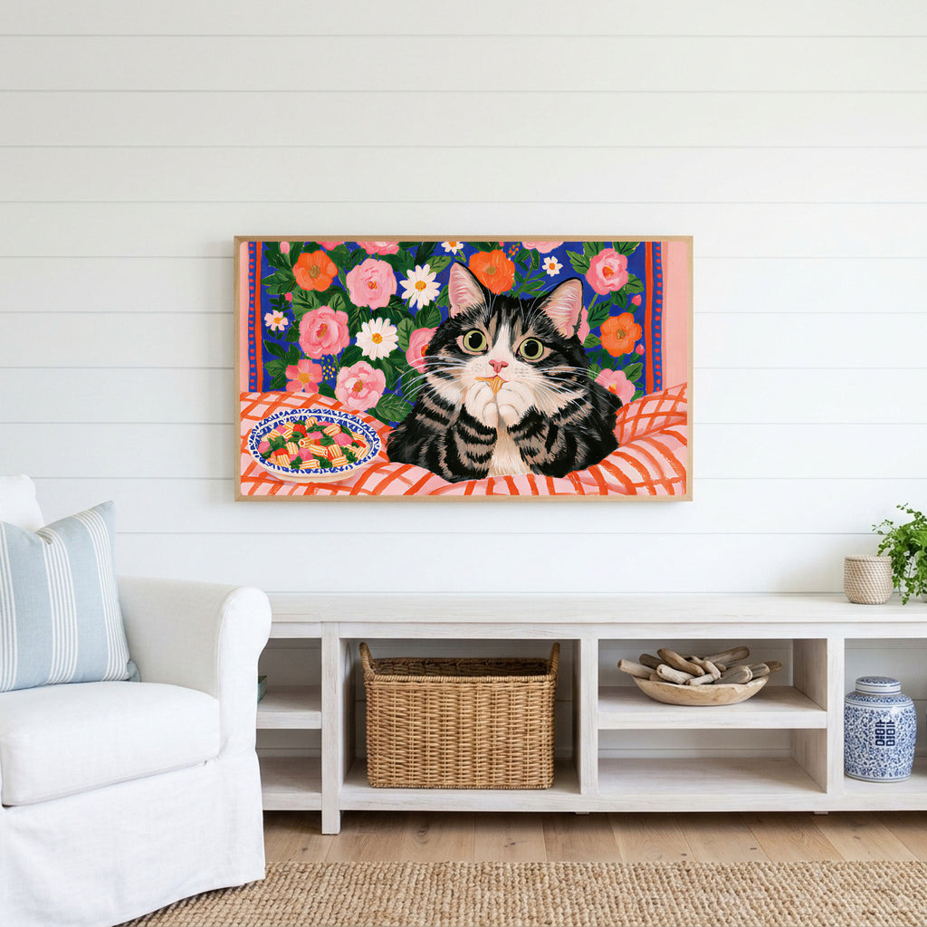Pasta cat Frame TV art above a white console with a rattan basket in a coastal living room