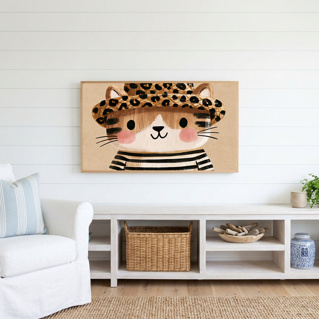 Kitten in a leopard hat Frame TV art above a white console with a rattan basket in a coastal living room
