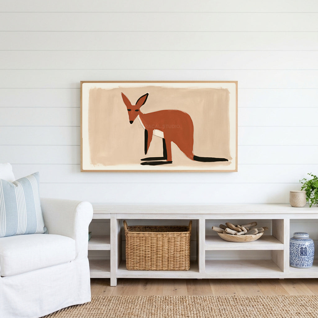 Minimalist wallaby Frame TV art above a white console with a rattan basket in a coastal living room