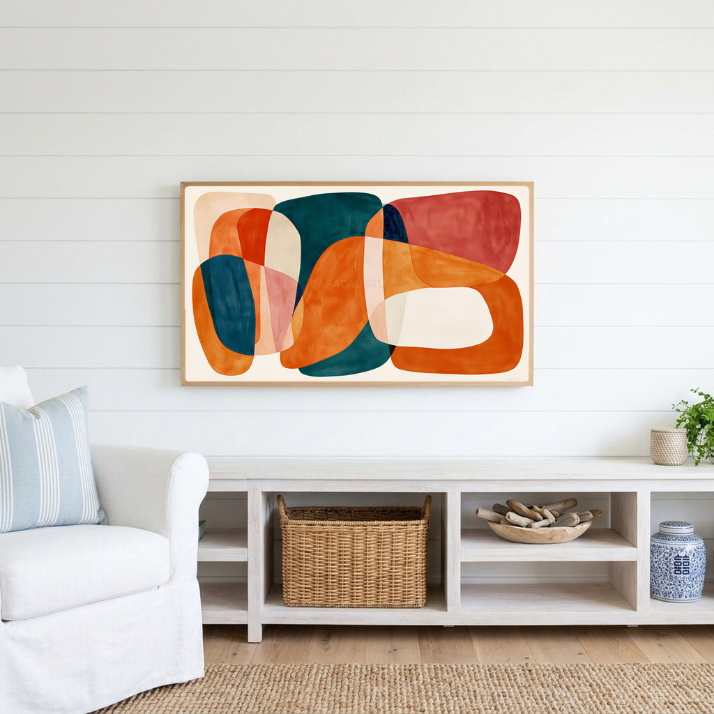 Organic shapes Frame TV art above a white console with a rattan basket in a coastal living room