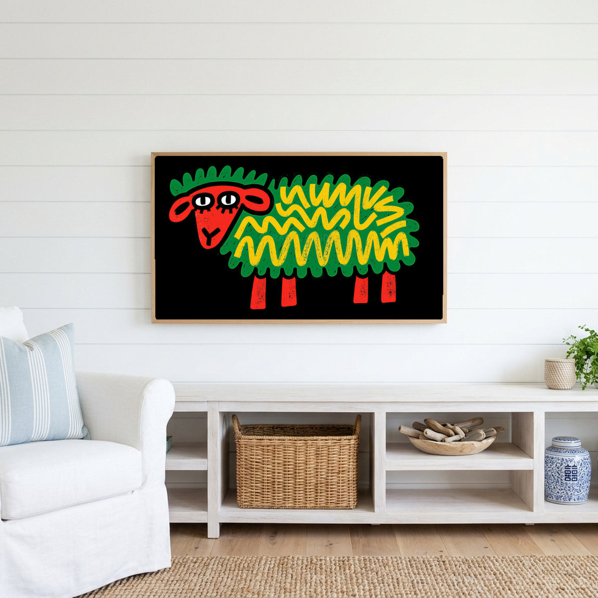 Pop art sheep Frame TV art above a white console with a rattan basket in a coastal living room