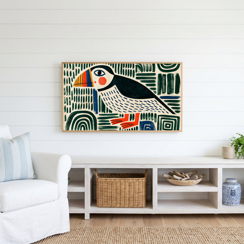 Folk art puffin Frame TV art above a white console with a rattan basket in a coastal living room